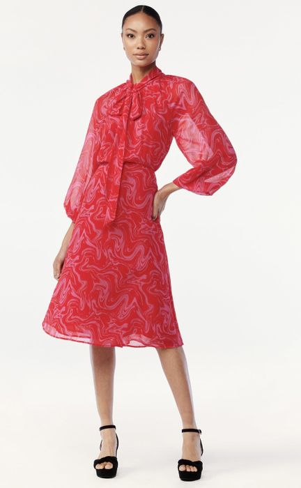 A model wearing the dress in navy.