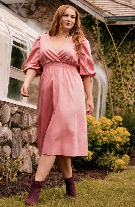 The dress in a soft pink hue.