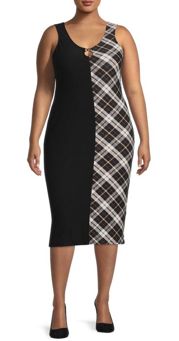 A model showing off the dress with a half black and half plaid design.