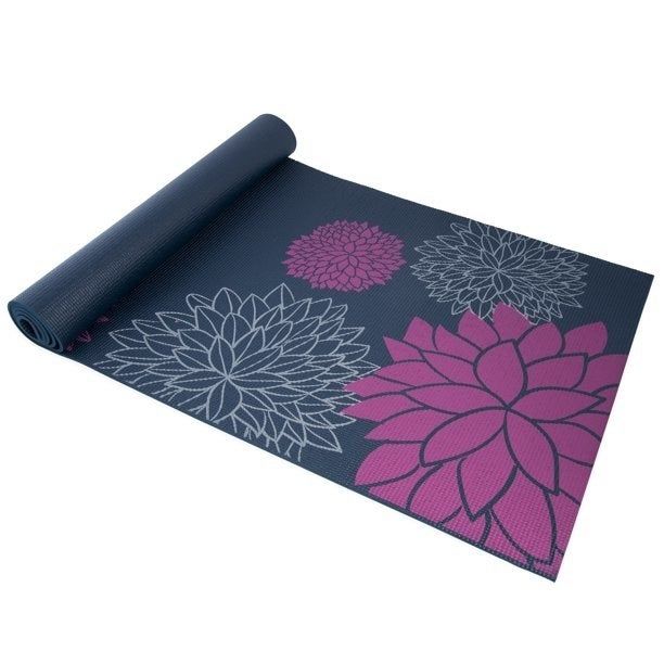A navy blue yoga mat adorned with a delicate light blue and purple flower design.
