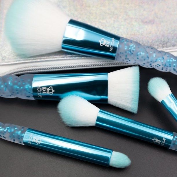 A set of blue brushes, complete with a convenient carrying bag for easy travel.