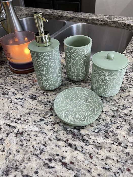 A photo from a reviewer displaying a green and white accessory set neatly arranged on a countertop.