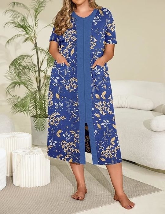Individual dressed in a home coat featuring a floral design, complete with a front zipper and convenient pockets