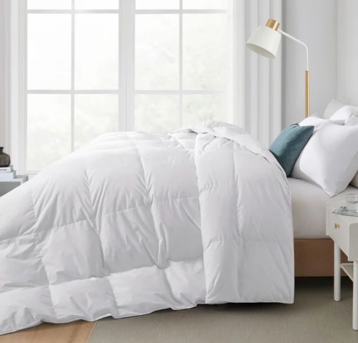 Features elegant golden satin piping along the edges