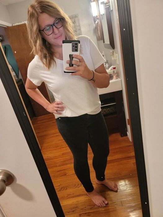A reviewer modeling the white shirt