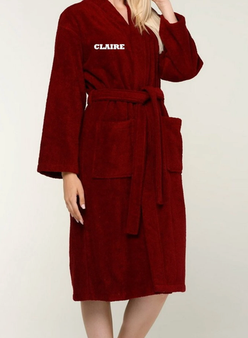 A model showcasing a red robe with the name