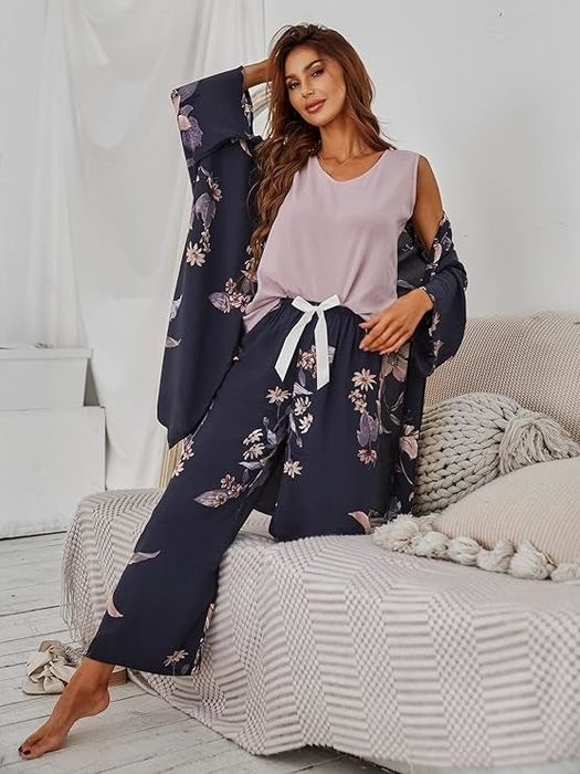A model relaxing on a sofa, dressed in a floral loungewear set