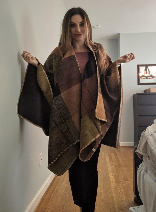 A reviewer showcasing the shawl in a relaxed, draped style