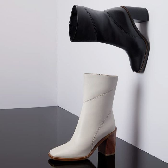 The chunky heel boots in a sleek black and white design