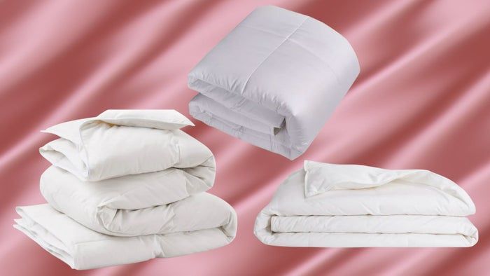 An AllModern down comforter, a Macy's down duvet, and a Brooklinen lightweight duvet.
