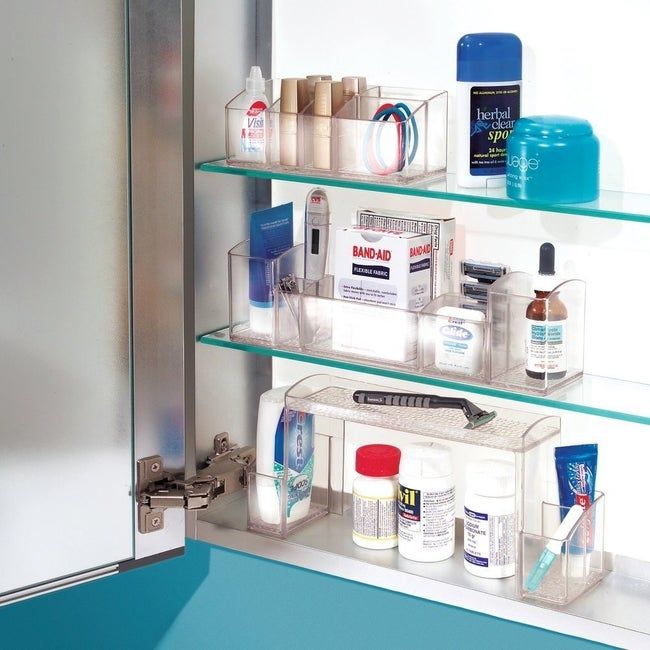 medicine cabinet with clear storage organizers that keep it neat and tidy