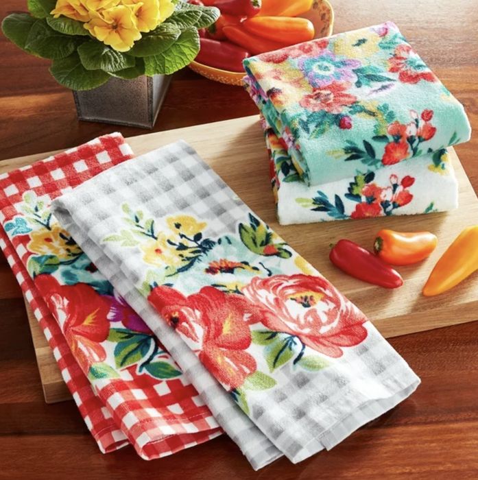 The towels neatly arranged on a cutting board.