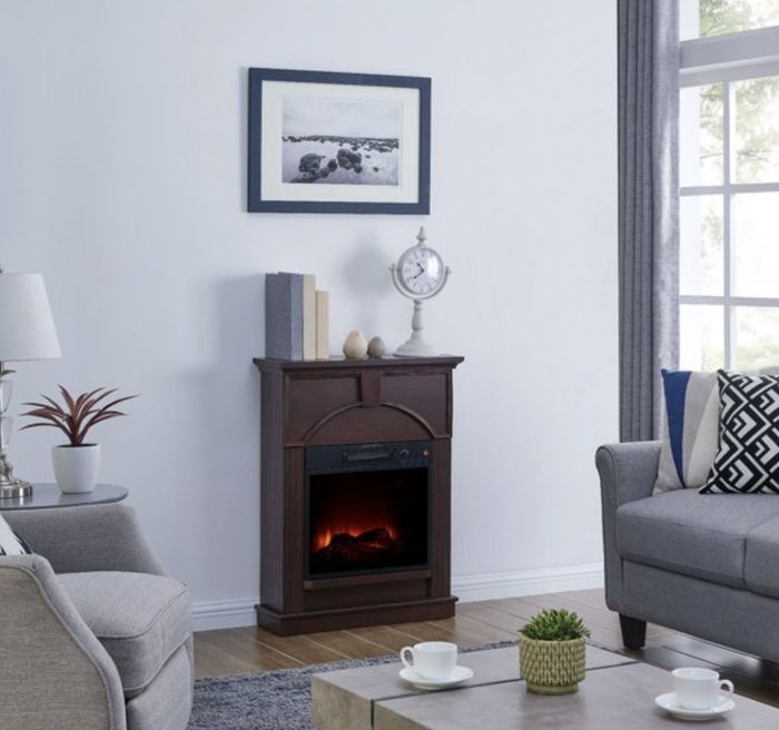 The brown electric fireplace set up in a cozy living room.