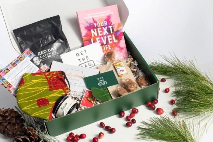a green box filled with an assortment of items