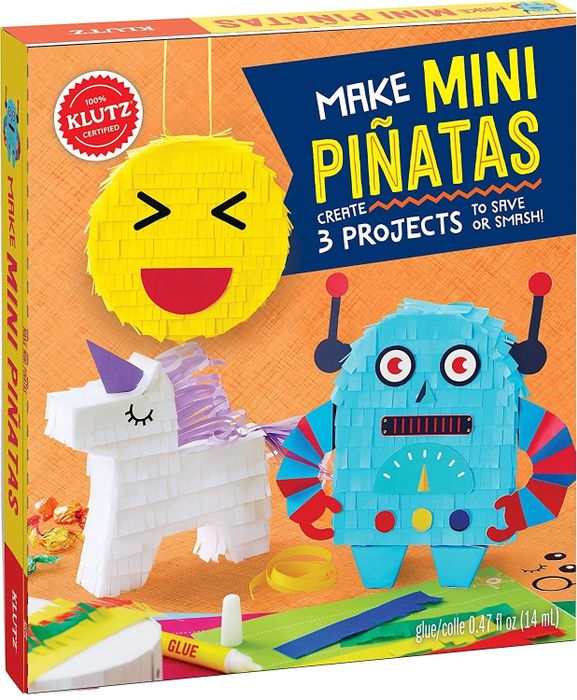 The box features vibrant designs of emoji, unicorn, and robot piñatas on its cover, promising a fun and festive crafting experience.