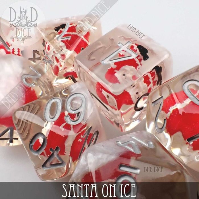 transparent dice featuring miniature Santa figures inside