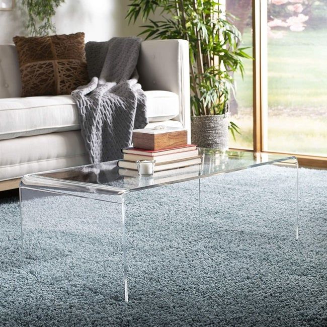 The transparent acrylic coffee table