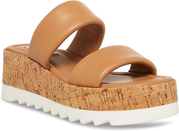 Tan platform sandal with a cork heel and white sole, showcased for shopping