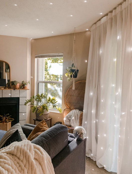 The same reviewer’s living room, now featuring the disco ball in place, adding a touch of sparkle to the space.