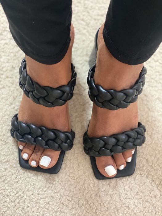reviewer sporting black chunky braided sandals