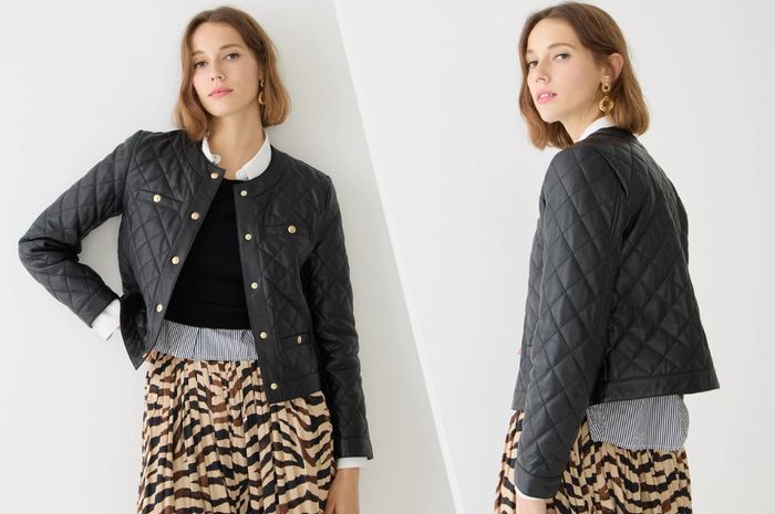 Here are two pictures of a model showcasing the black jacket.