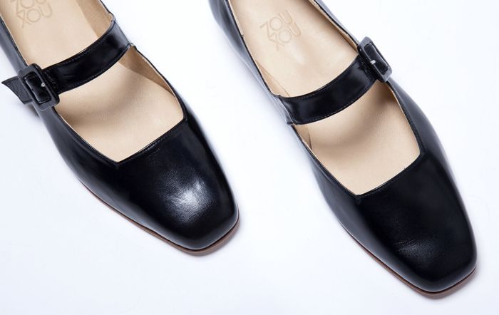 A detailed close-up of the almond-toe design on the Mary Jane shoes.