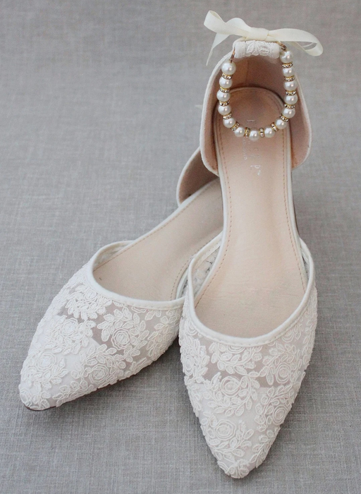 white flats with pearl straps