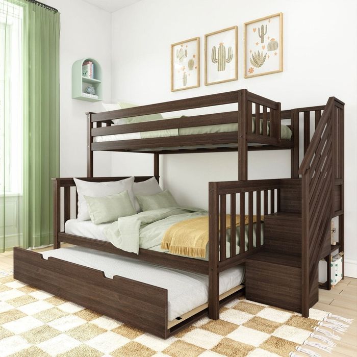This wooden bunk bed with built-in stairs includes a pull-out trundle and is decorated with cactus-themed artwork, creating a trendy and functional design for a modern children's room.
