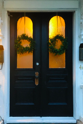 A reviewer's double doors, now painted a bold black, adding elegance to the entrance.