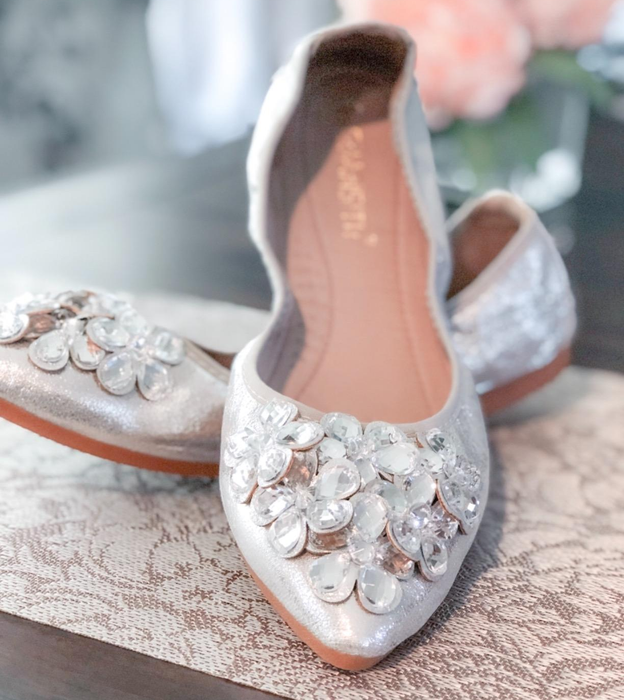 reviewer showing a close-up of the silver rhinestone flats