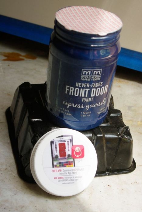 A reviewer's can of vibrant blue paint, ready for a transformation.