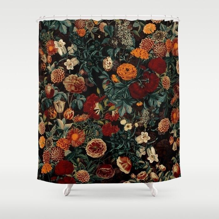 A black shower curtain beautifully decorated with dark marigolds and other flowers in rich hues of orange, deep red, and cream.