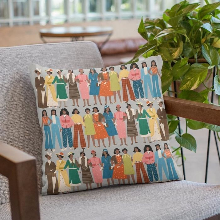 A square decorative pillow featuring three distinct lines representing women's fashion trends across various decades.