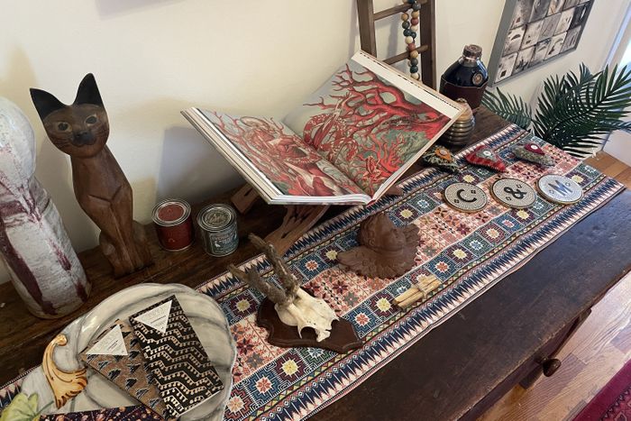 Here’s a look at my entryway table, filled with a mix of decor, with the table runner placed underneath it all.