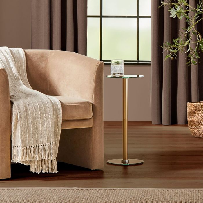 a petite gold side table
