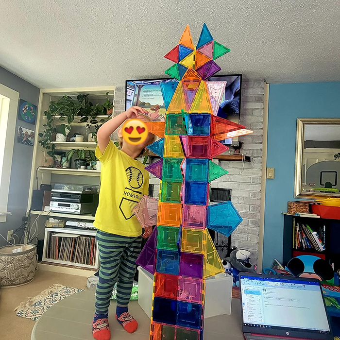 A child constructing something with the tile set
