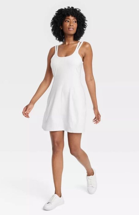 model in white knit exercise dress