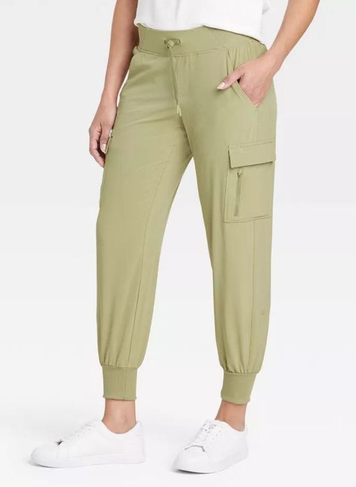 model showcasing olive green woven pants