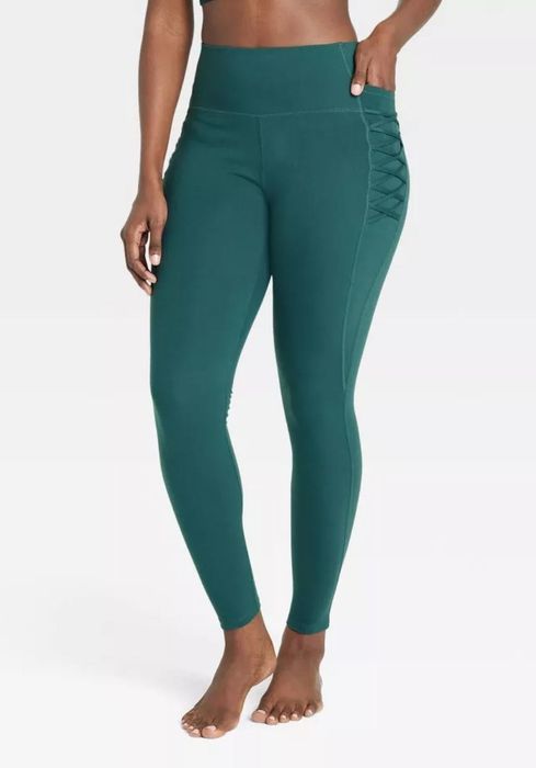 model wearing indigo criss-cross leggings