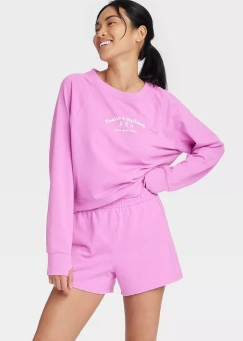 Model sporting pink terry shorts.