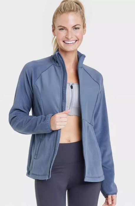 model wearing blue fleece zip-up jacket