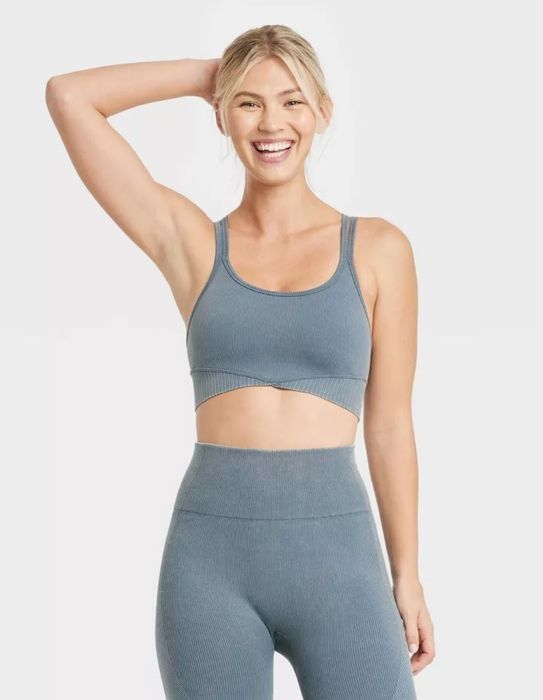model wearing slate blue ribbed sports bra