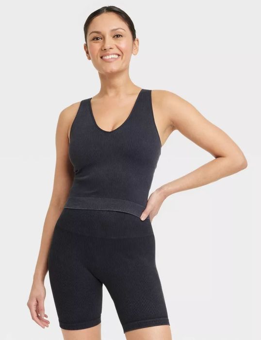 model wearing black workout tank
