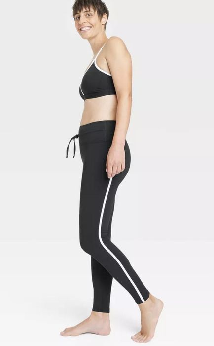 model wearing black drawstring leggings