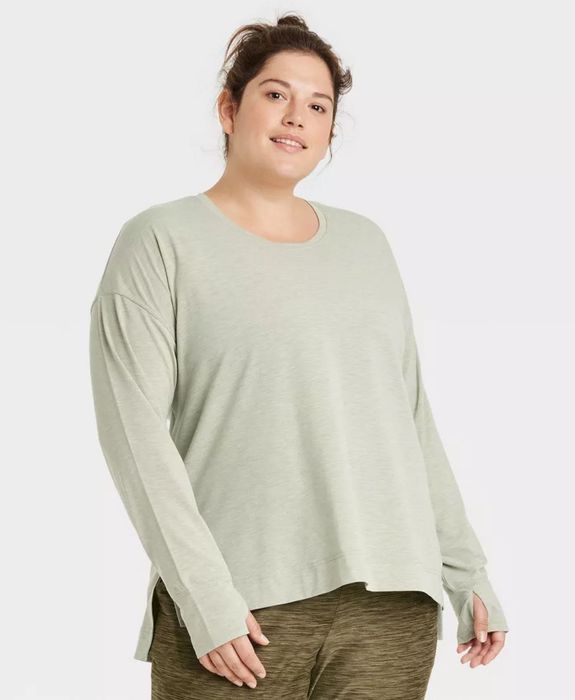 model wearing light green long-sleeve top