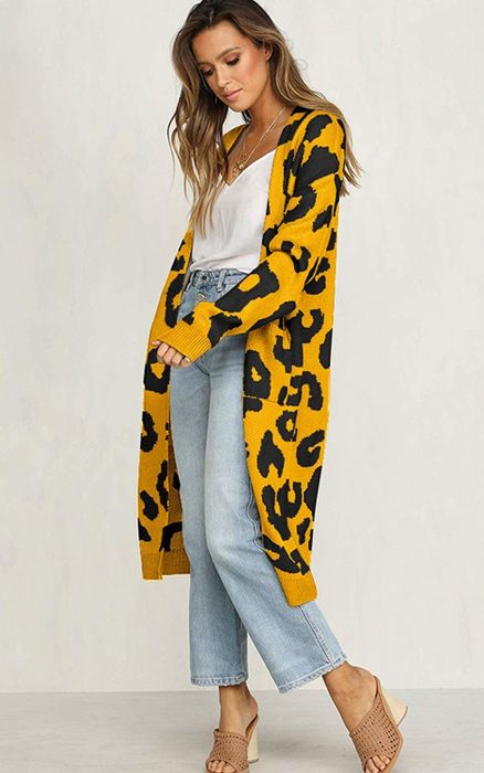 The model wears a cardigan with a bold, oversized leopard print.