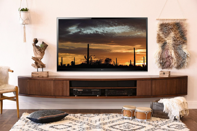 Image showing the arc-shaped brown TV stand