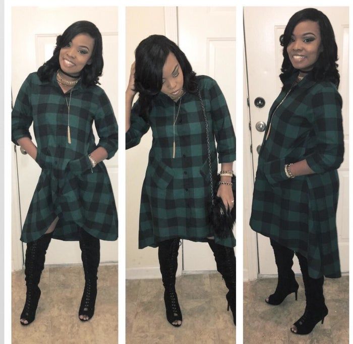 A reviewer dons a plaid flannel dress with a high-low hemline.