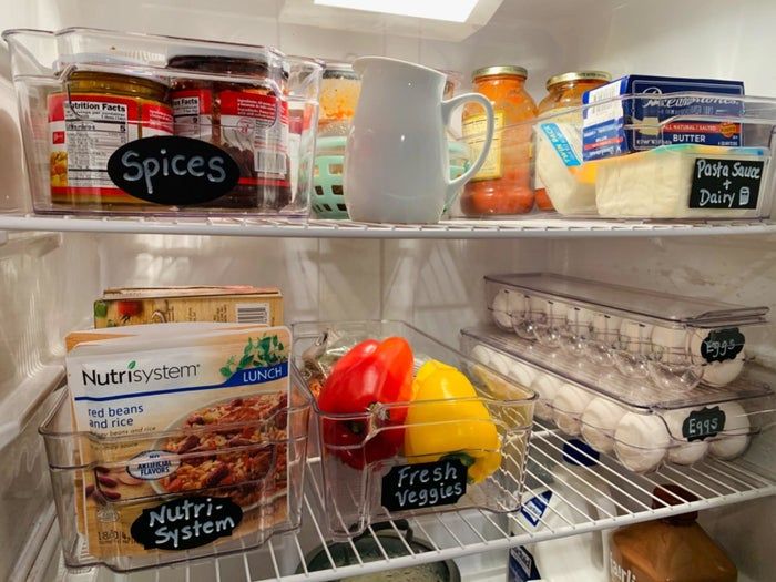 A reviewer's fridge filled with several labeled pantry organizers.