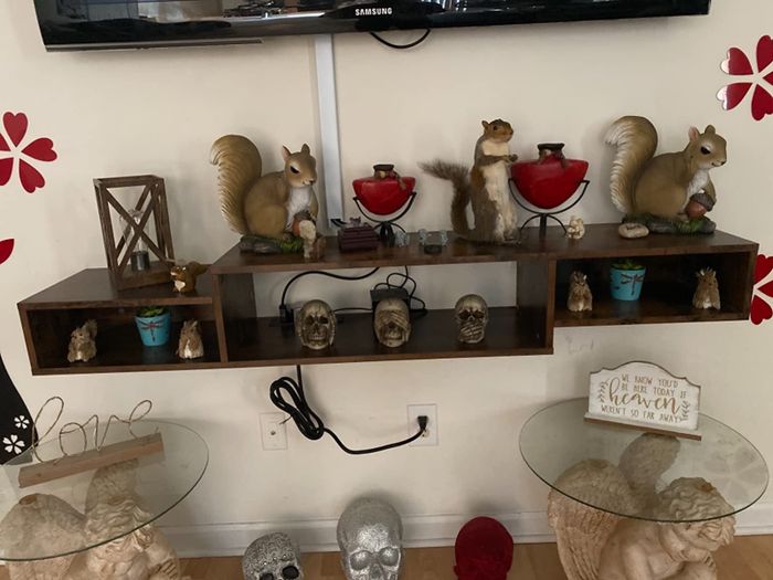 A reviewer’s image showing a brown TV stand in use.